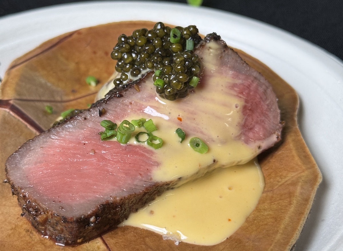 Photo Oct 23 2025 5 57 40 PM - DiningOut Pearl & Vine's achiote striploin with smashed potatoes, Codigo Rosa ranchero hollandaise and Kaluga hybrid caviar at the 2025 RARE Steak Championship in Houston. | Photo by Zain Mohammed