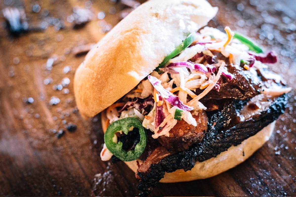 - DiningOut The pitmaster sandwich at Pecan Lodge. | Photo by Robert Strickland