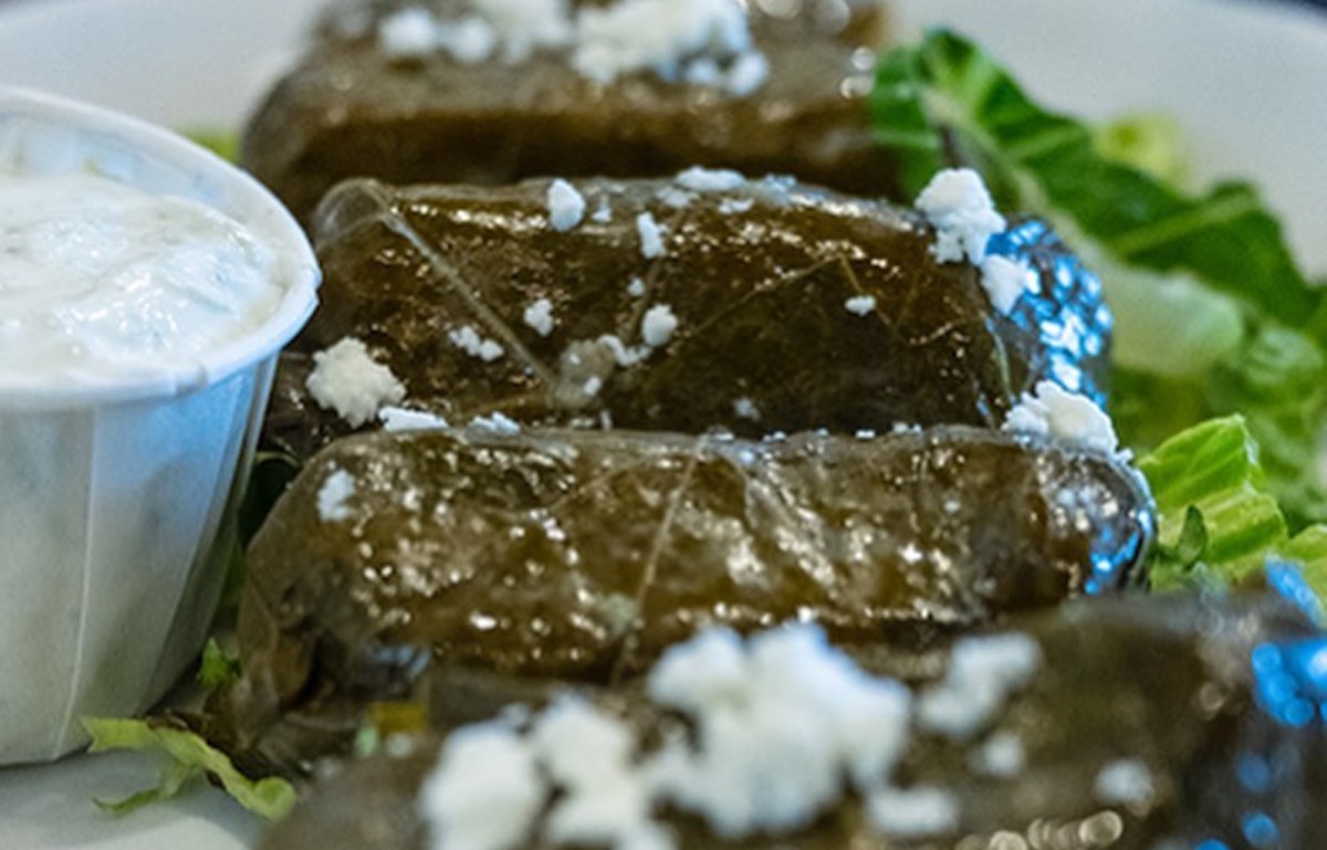 Grape leaves with dipping sauce at Platia Greek. | Photo by Platia Greek