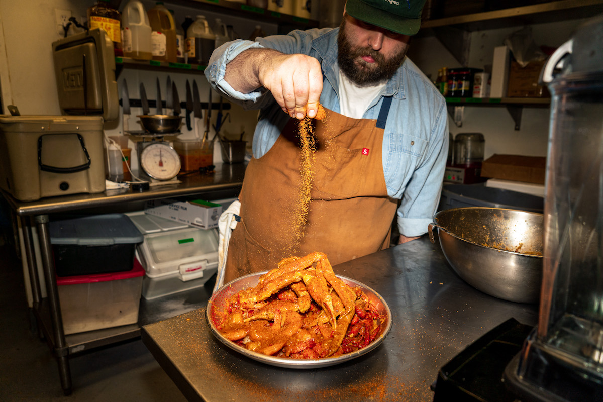 - DiningOut Chef Lucas McKinney seasoning crawfish at Josephine's Gulf Coast Tradition. | Photo by Dylan McEwan