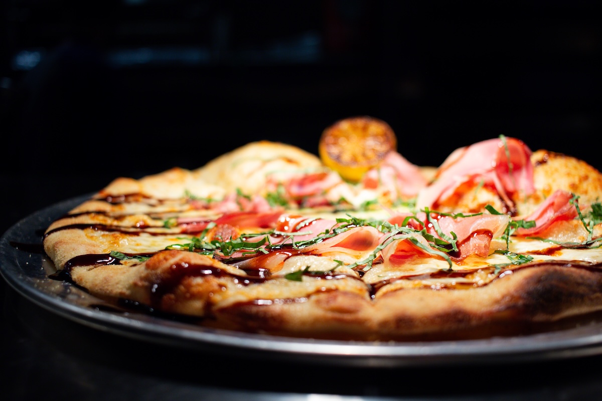 Clarks_JustinCook-1701 - DiningOut Prosciutto pizza with balsamic drizzle. Photo by Leven Supply