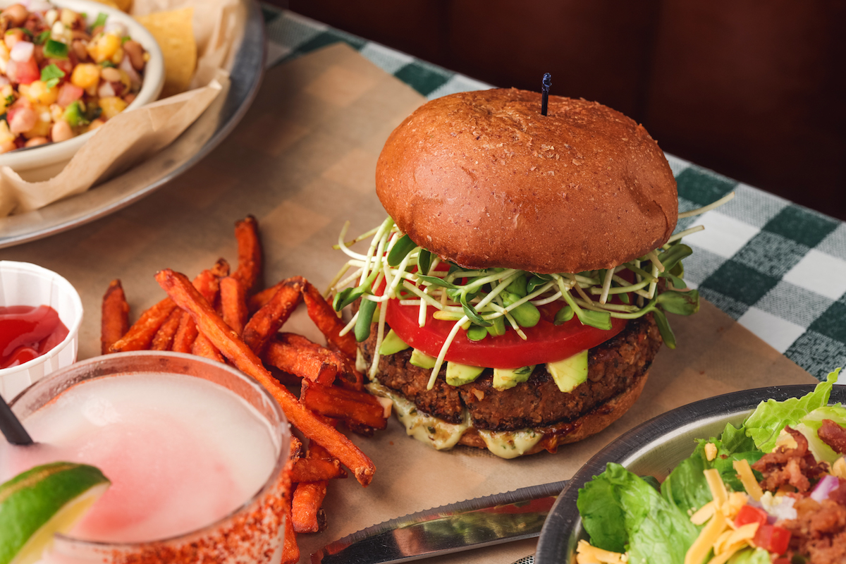 Hecate_boston- - DiningOut The Neil Young burger at Rodeo Goat, a meatless burger wth a vegan patty, sprouts, tomato, avocado, and green goddess dressing. | Photo by Allison David