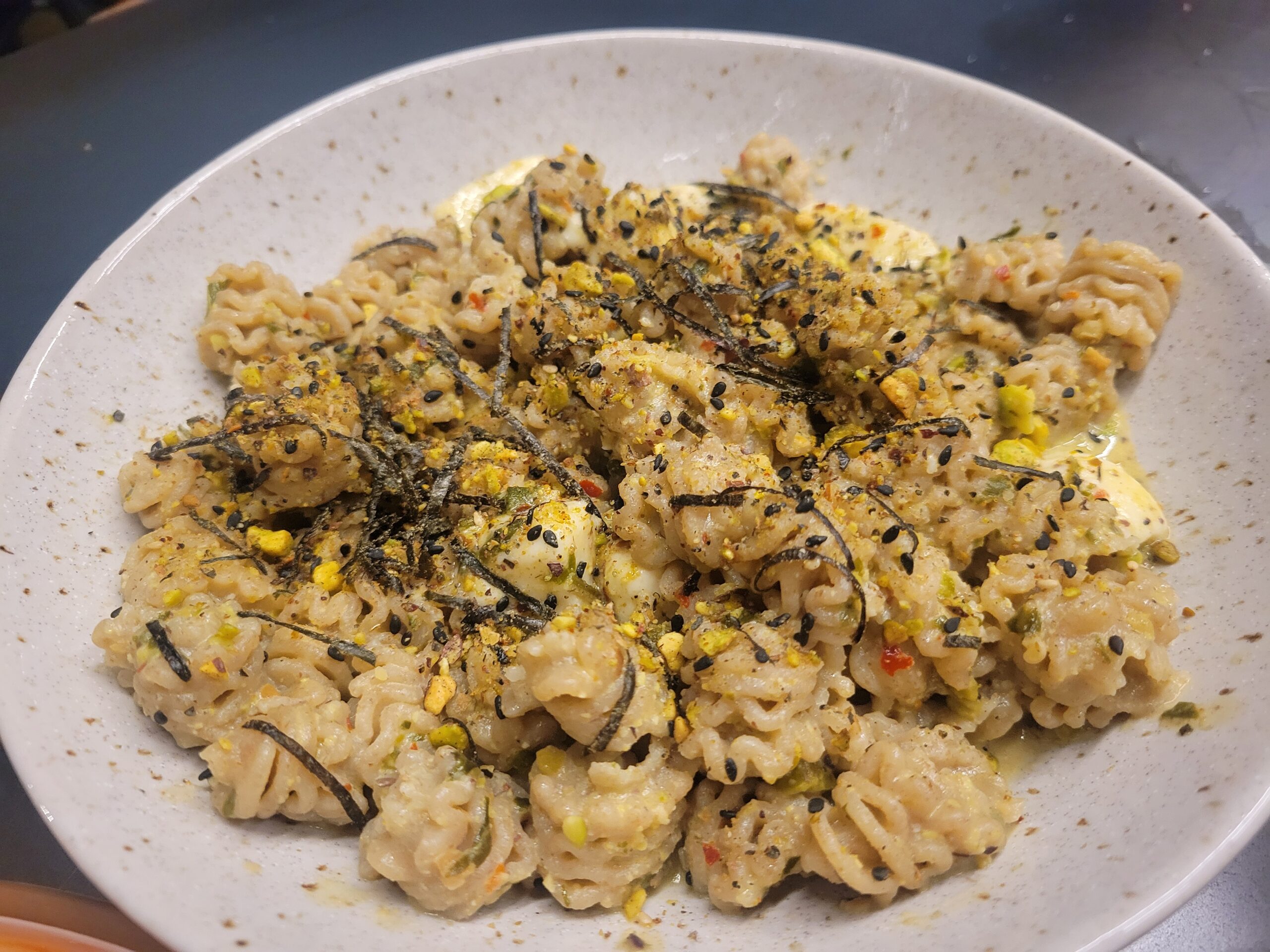 green pasta on a white plate trends dio bio