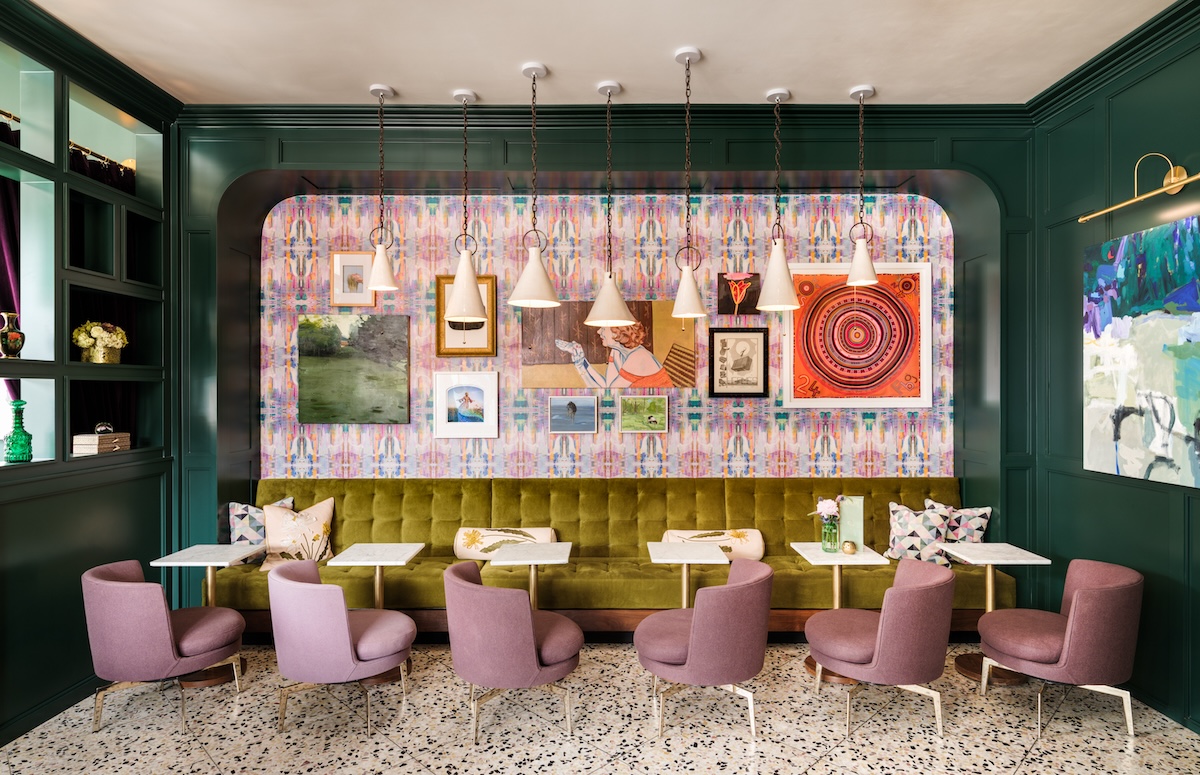 bar with pink chairs and wall