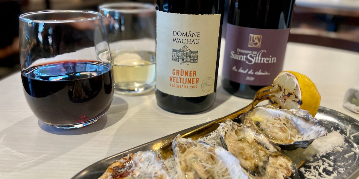 Fresh, seasonal flavors prevail out west in the Denver Highlands neighborhood. Newcomer restaurant Rooted Craft Kitchen has created a cozy gathering place where food, wine, and cocktails are made simple, approachable, elevated, and delicious. Wood-grilled oysters on the half served with charred lemon, butter, thyme, and panada have quickly become a menu staple. When variety is the order of the day, a duo of impressive wines by the glass is a great way to work past indecision. For a sublime Autumn white, the Grüner Veltliner Federspiel from Domäne Wachau is loaded with Fall fruit flavors like apple and white pepper with just a hint of smokiness that’s divine with the oysters. A pour of the Domaine de Saint Siffrein Côtes du Rhône Villages is a beautiful way to respond when red wine is called for. A blend of Syrah and Grenache, the wine is structured, balanced, and intense enough to satisfy an entire table of wine lovers. This winery is committed to quality and sustainability and is known for producing Village-level wines and the revered Chateauneuf du Pape.