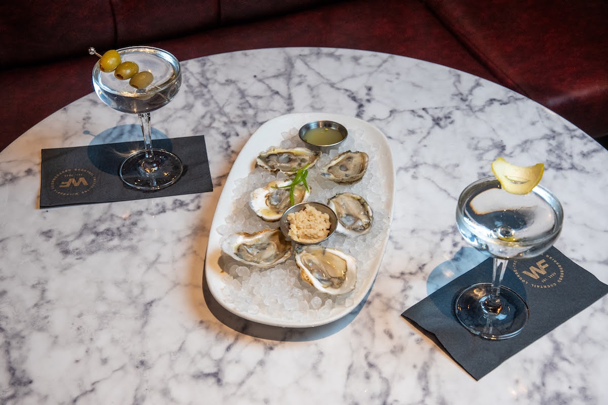 - DiningOut Martinis and raw oysters on the half shell at the Wilfred. | Photo by the Wilfred