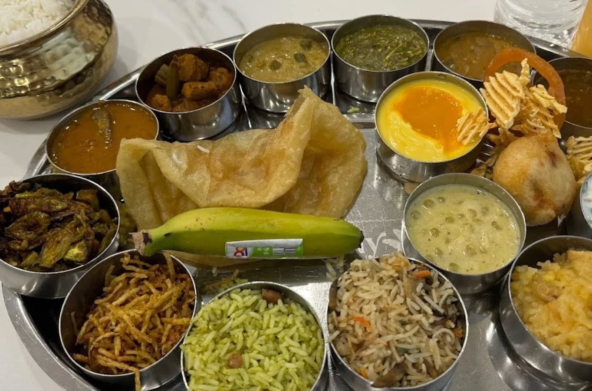 - DiningOut A thali with various vegetarian dishes, rice, and roti at Simply South. | Photo by Simply South