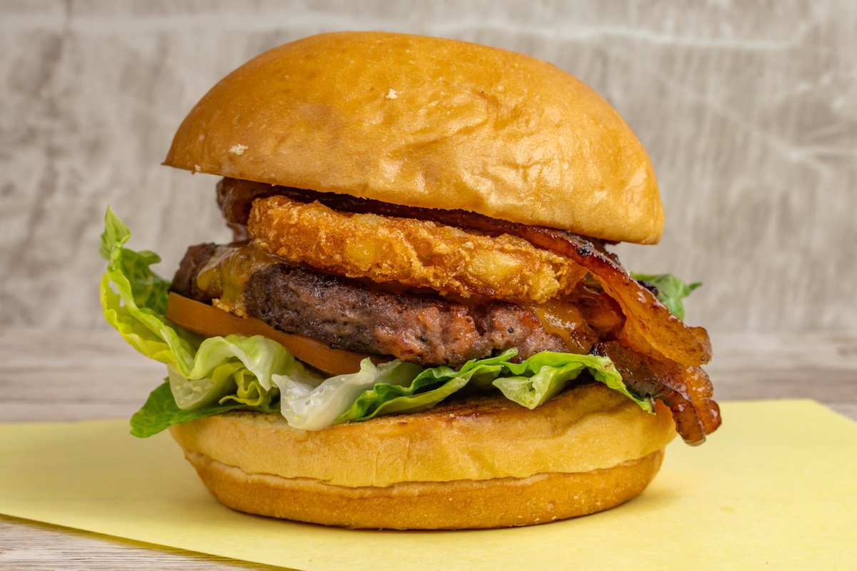 The-African-Meeting-House-at-the-Museum-of-African-American-History - DiningOut The Miss Piggie, at Stanton's City Bites, a combination of ground bacon and beef, topped with candied bacon, hash brown, cheddar, lettuce and tomatoes. | Photo by Stanton's City Bites
