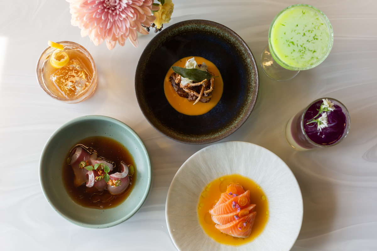 A spread of sushi, sides, and cocktails at Aiko. | Photo by Studi Rivera