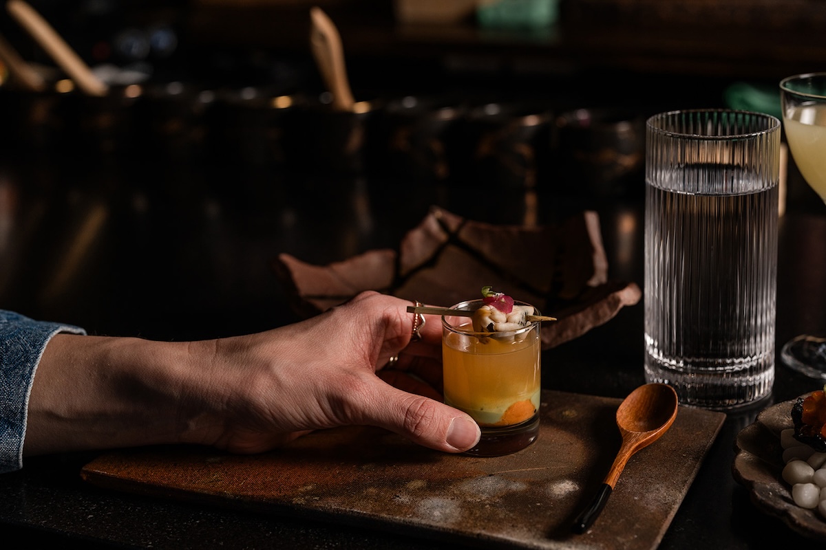 - DiningOut Green mussel and sea urchin sake shooter at Sushi By Scratch. | Photo by Larimer Square Marketing