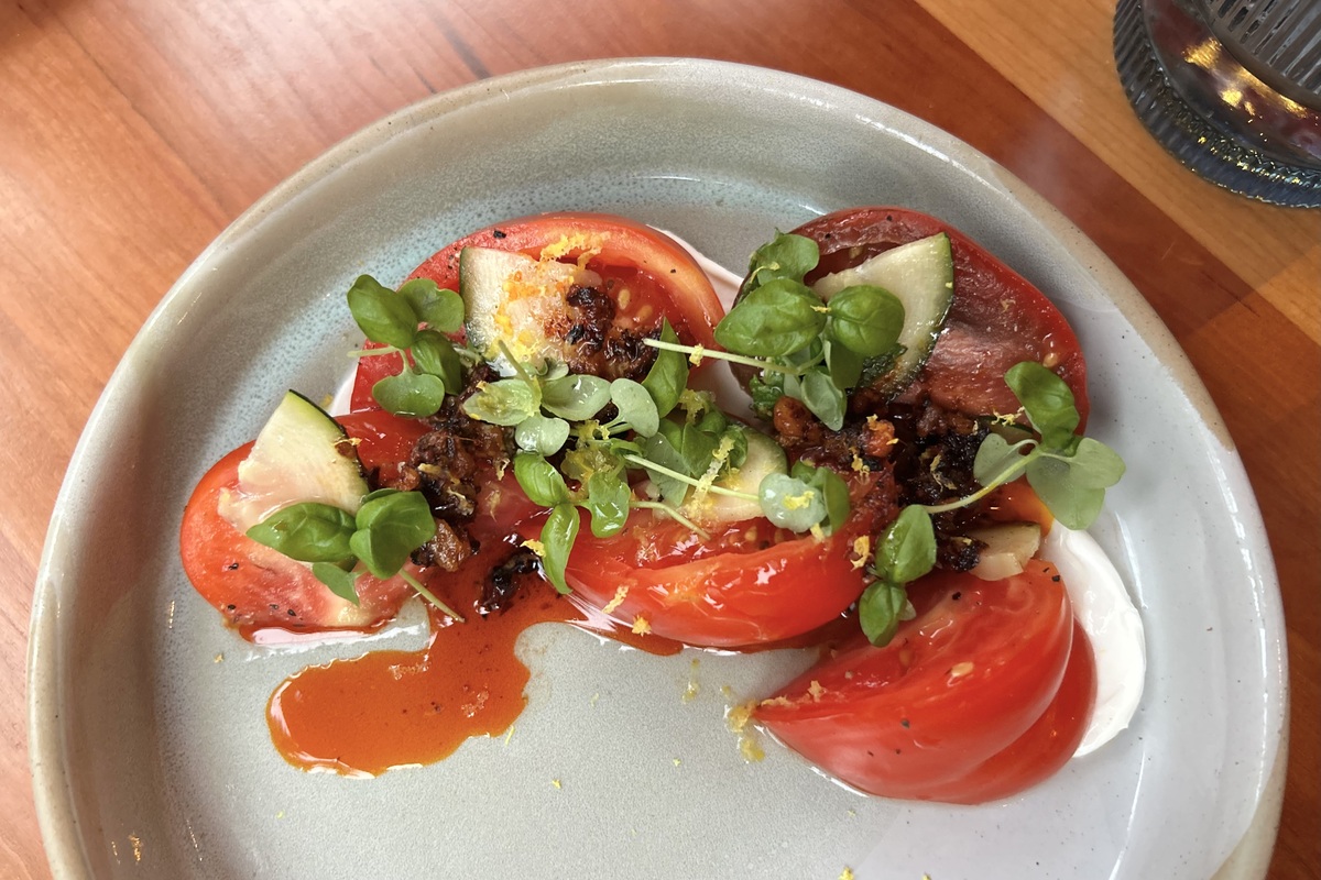 Jaschke_DiningOut_110424-0104-scaled - DiningOut Salsa macha adds a smoky spice to the Heirloom Tomato Salad | Photo by Abigail Bliss