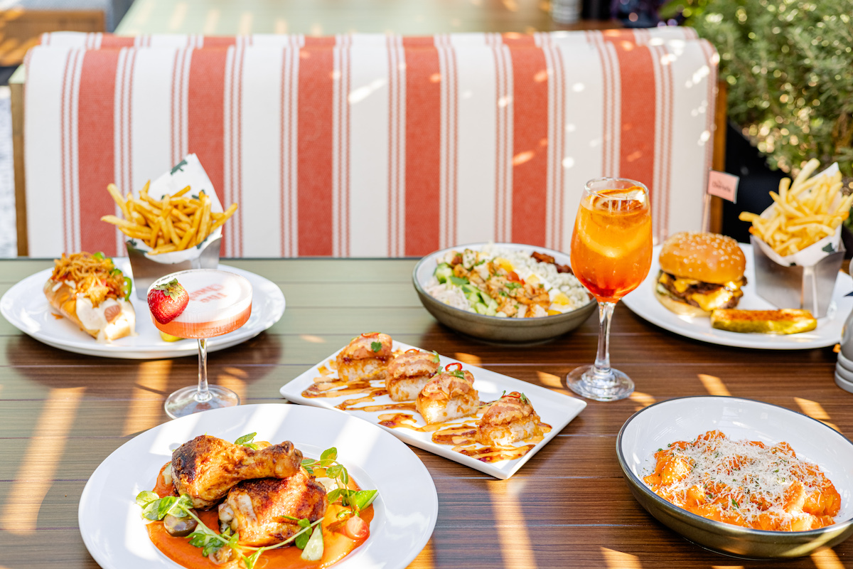 A happy hour spread of food and cocktails at the Charlotte. | Photo by the Charlotte