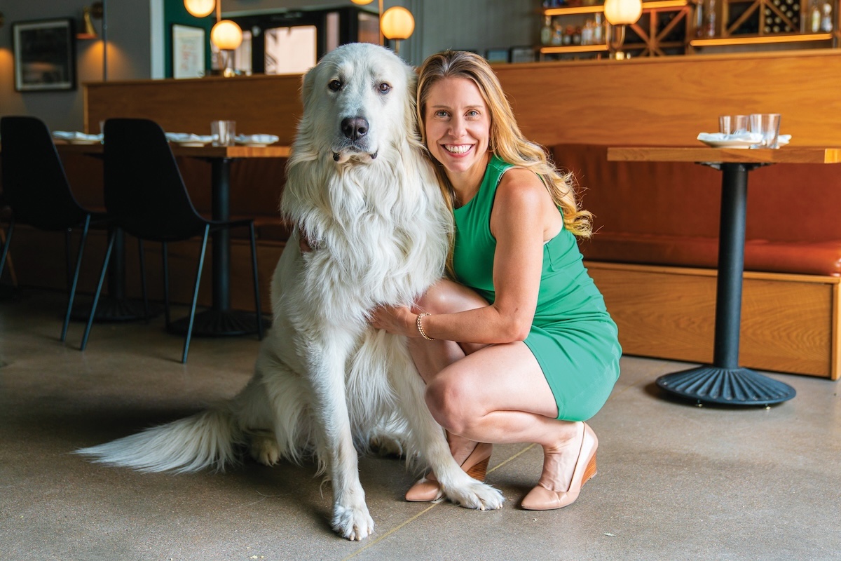Delores Tronco, owner of The Greenwich has a dog taller than herself. | Photo courtesy of Delores Tronco