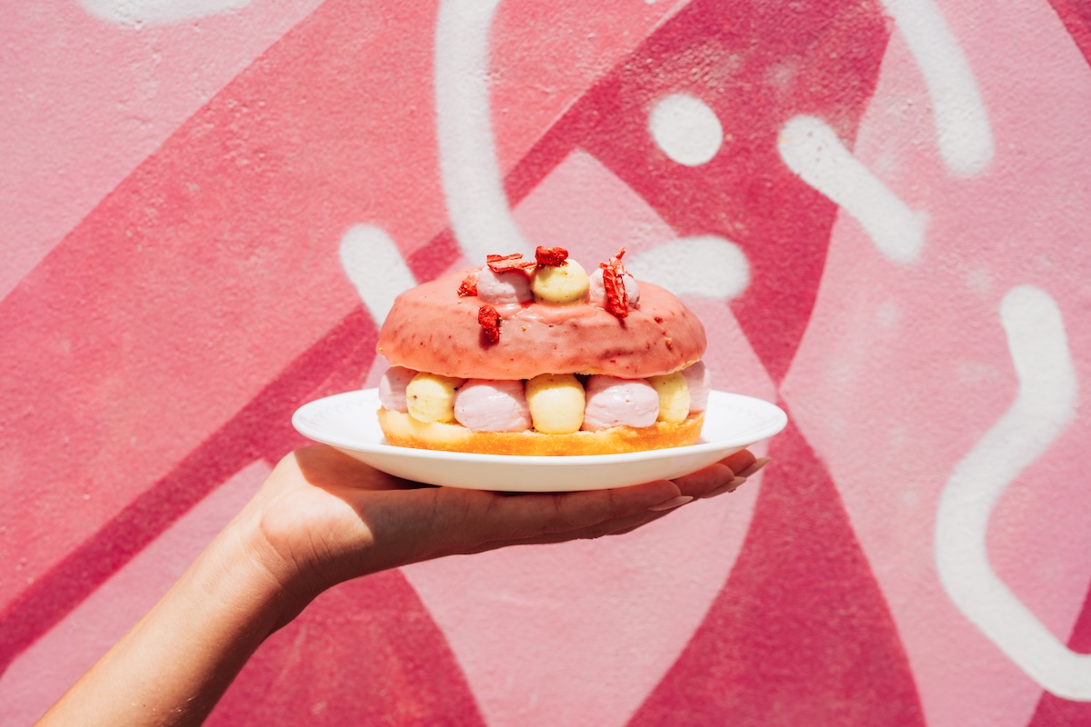 Grab this pretty pink doughnut for a good cause. | Photo by The Salty