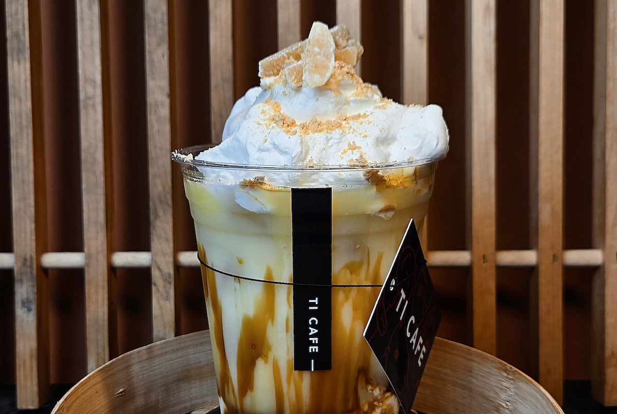 golden coffee drink in plastic cup