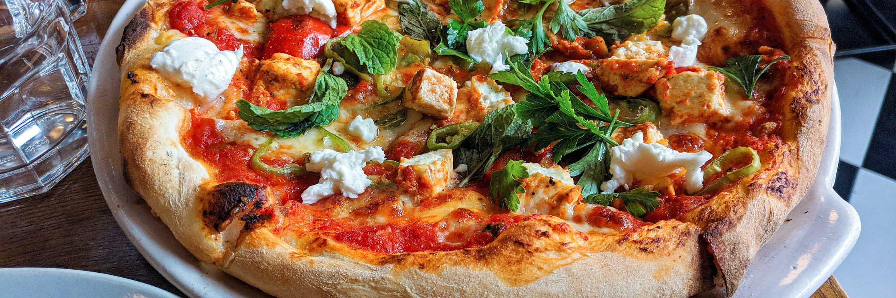 Mountain pie has a hand-rolled edge of daily made dough creating a barrier to hold in a mountain full of fresh toppings, to satisfy an adventurous appetite. 