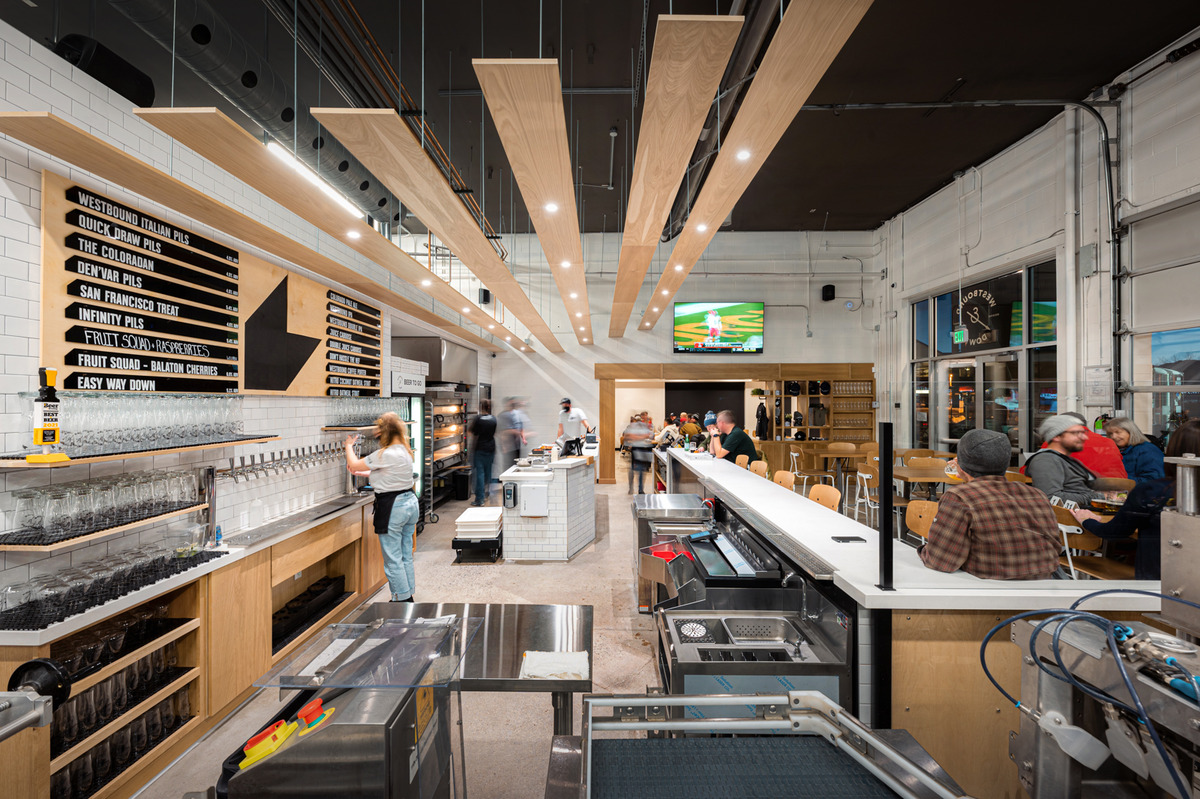 A coffee cheers outside Good Boy Cafe, located inside Hey Koneko. | Photo by Desiree Gutierrez