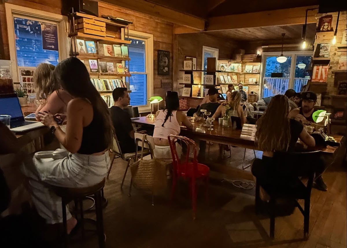 Customers surrounded by walls of books at the Wild Detectives. | Photo by the Wild Detectives