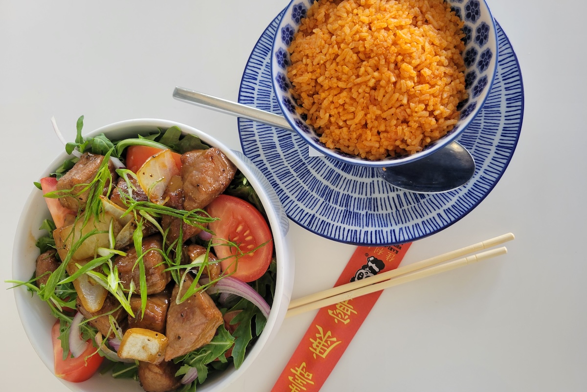 - DiningOut Global bowls of beef and red rice and chopstick