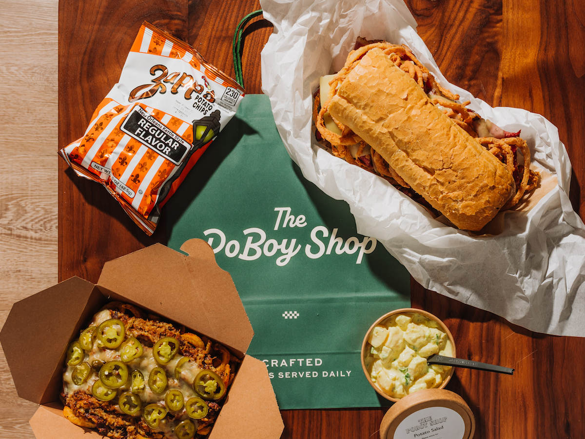 - DiningOut A hot pastrami po-boy with Make it Dirty fries and potato salad at the Po Boy Shop. | Photo by Chase Hall