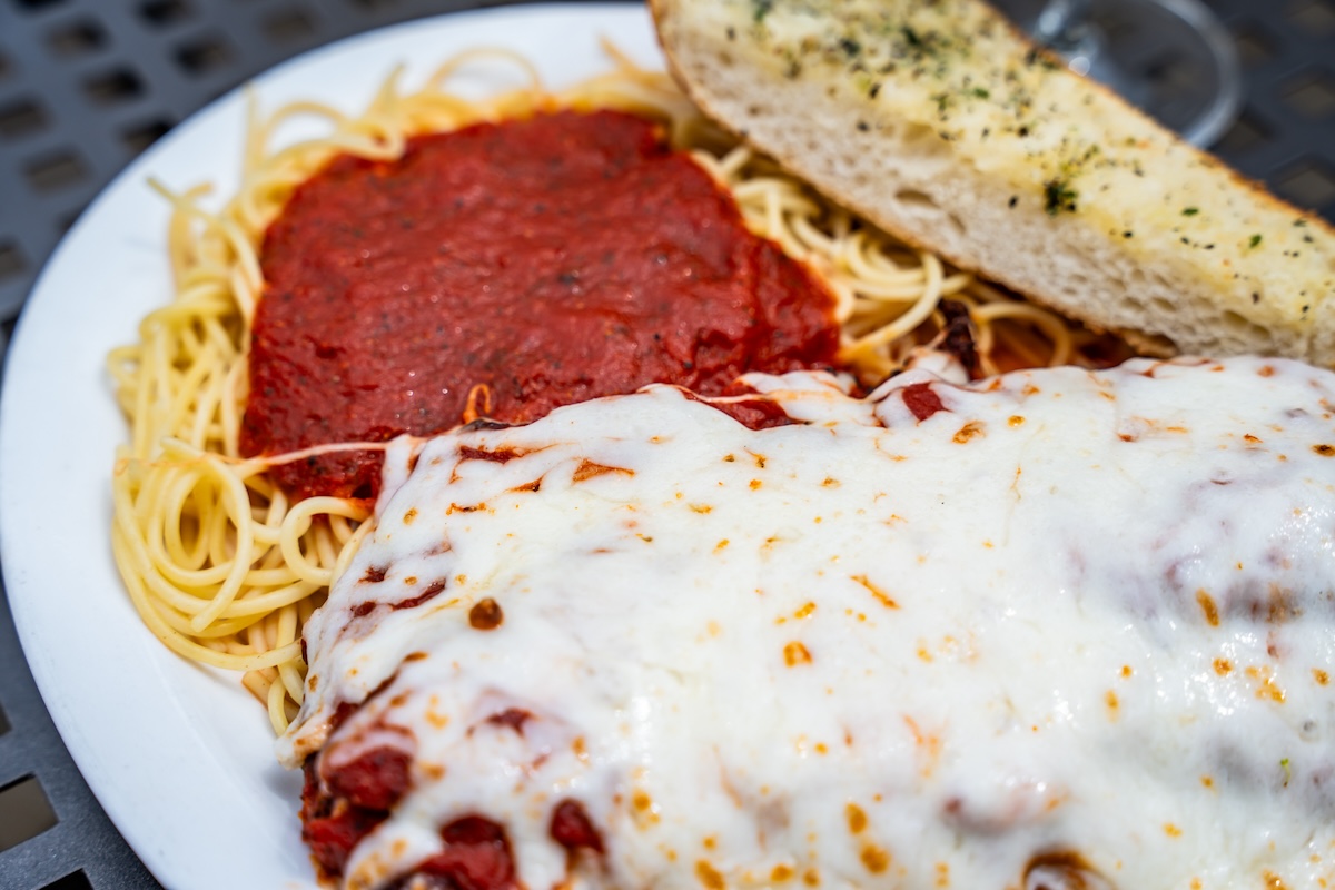 - DiningOut Global Chicken parm is a hit at this Littleton hot spot. | Photo by Angelo's Taverna