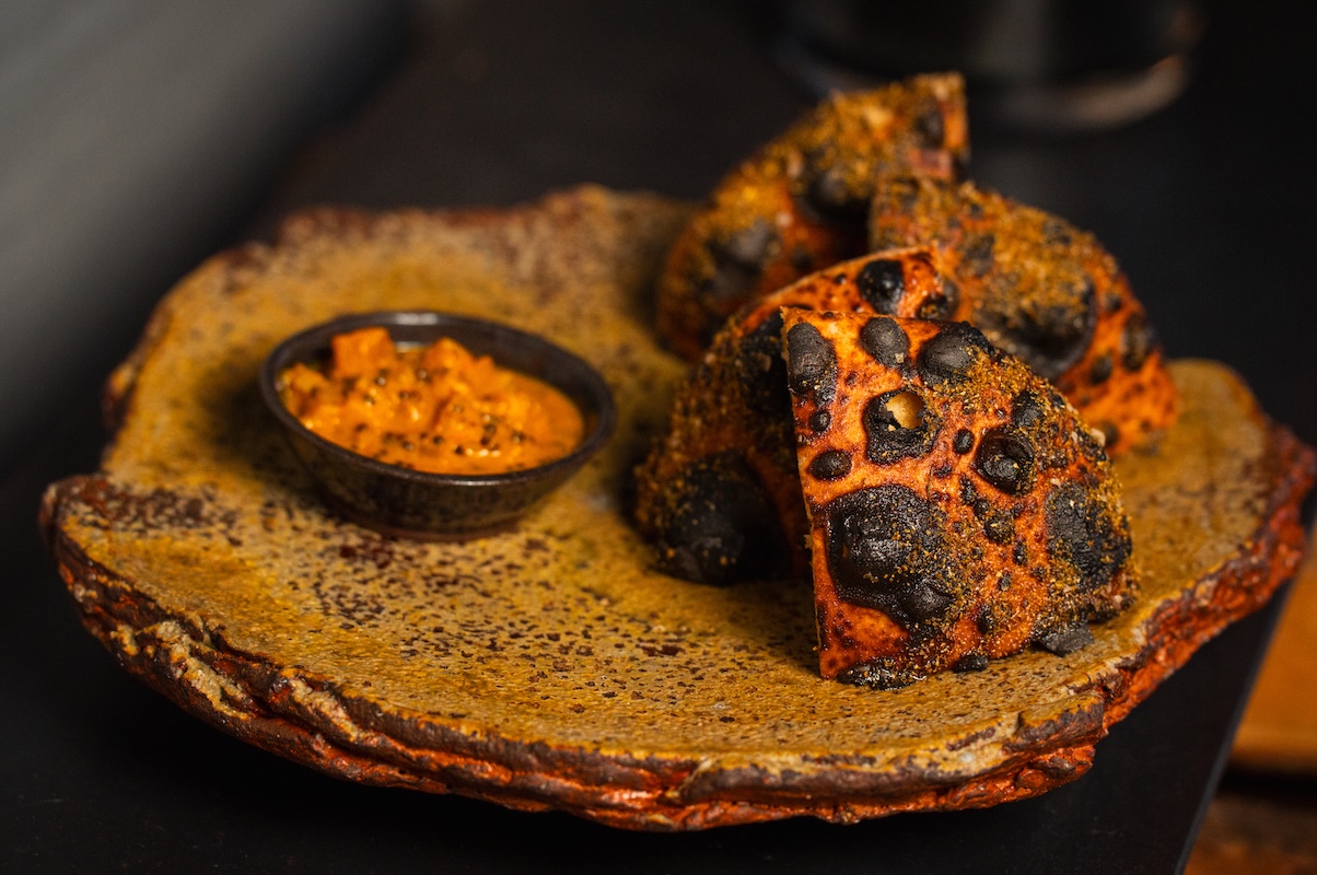 BRUTO serves wood-fired bread, often with a preserve or fermented component. | Photo by Jeff Fierberg