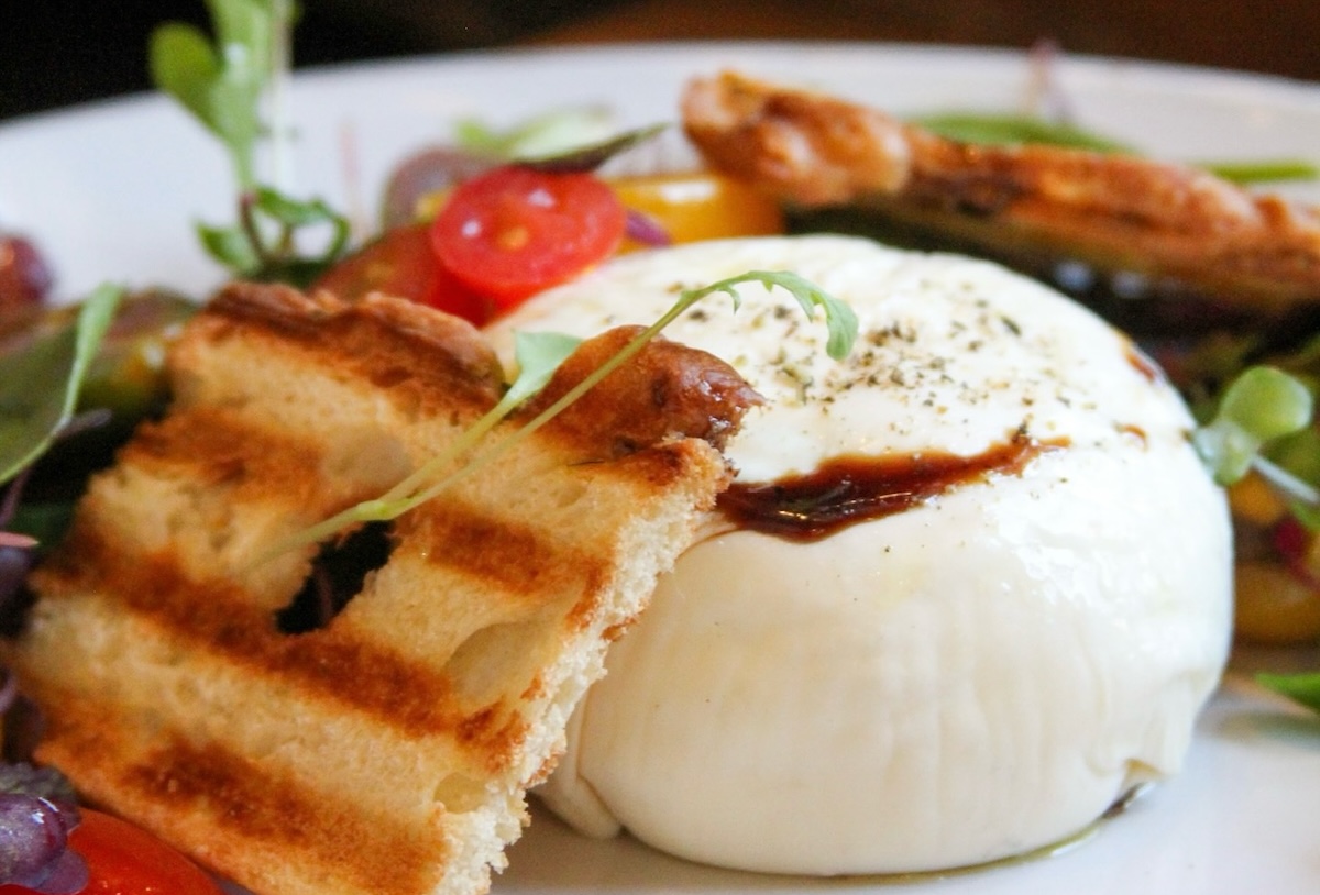 71c4c5a8-cb22-4e97-92a5-11edddd7ed5d - DiningOut Global Erica Lopez recommends the burrata. | Photo courtesy of Osteria Marco