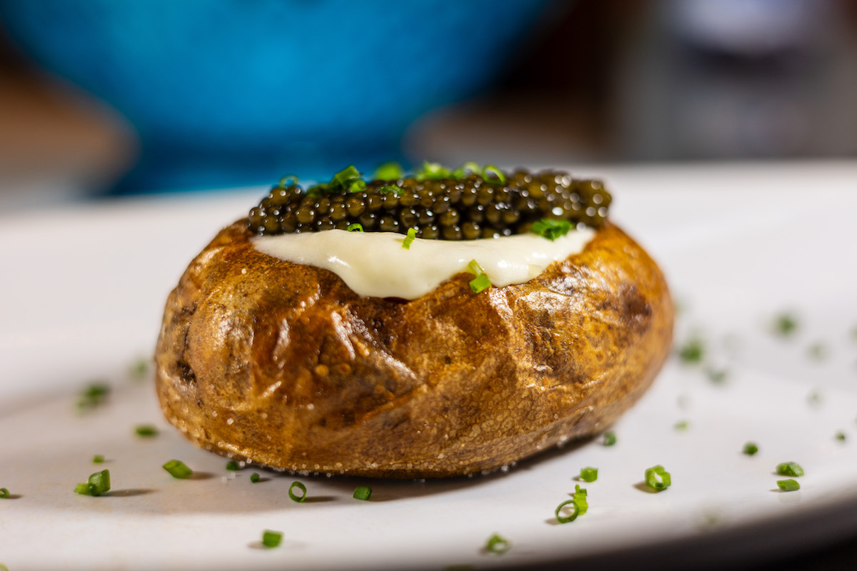 Tony’s takes the humble potato to Gilded Age heights with its 0 spud topped with a king’s ransom of Kaviari Oscietra Gold. | Photo by Caroline LeGates