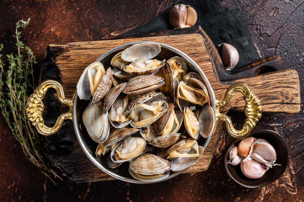 - DiningOut Garlic white wine shells Clams