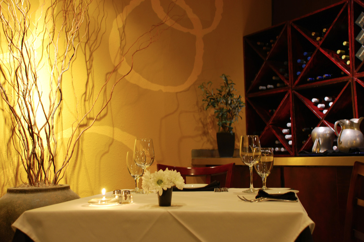 A corner table in the dimly lit dining room at Gorji. | Photo by Gorji