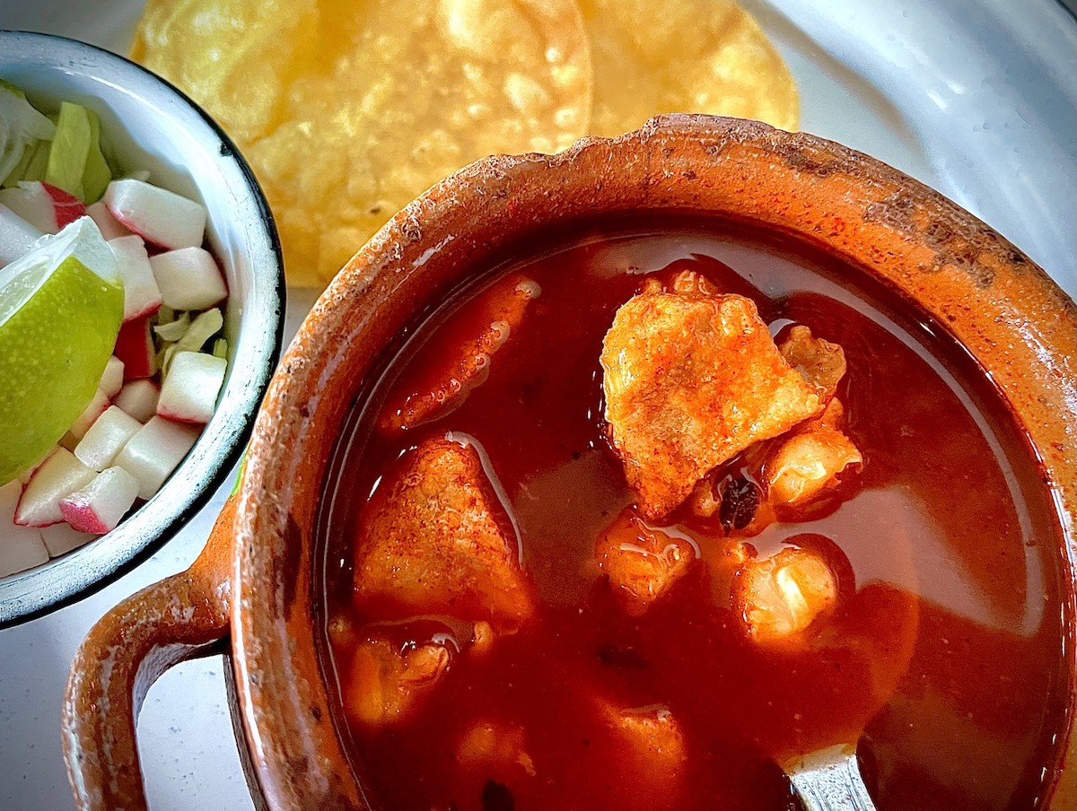 Pozole rojo (pork and hominy in a spicy red chile broth) is available in a half size at Cuchara. | Photo by Greg Morago