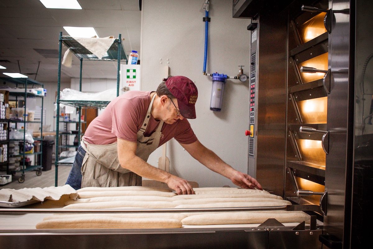 - DiningOut man making bread