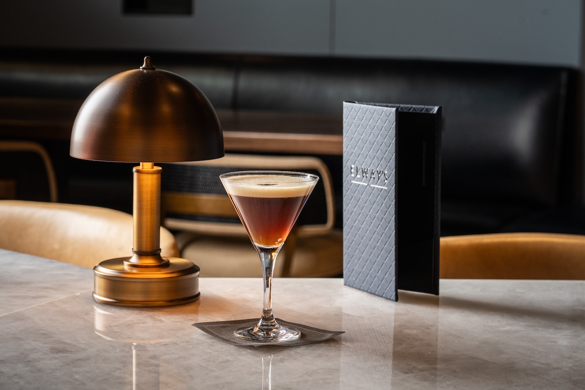 espresso martini next to menu on table