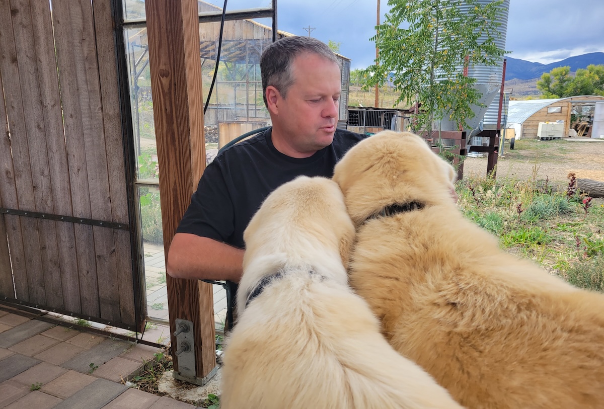 Chef and farmer Eric Skokan with some of his working dogs. | Photo by Linnea Covington