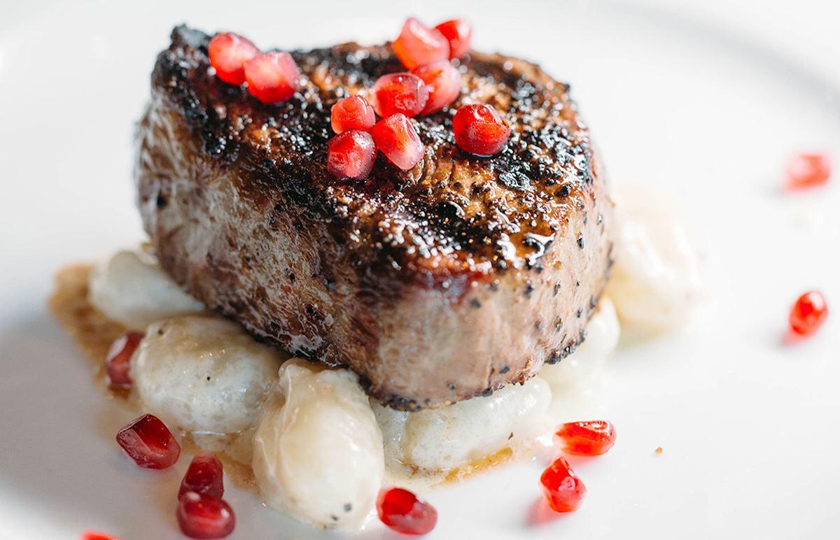 Steak garnished with pomegranate seeds at Gorji. | Photo by Gorji