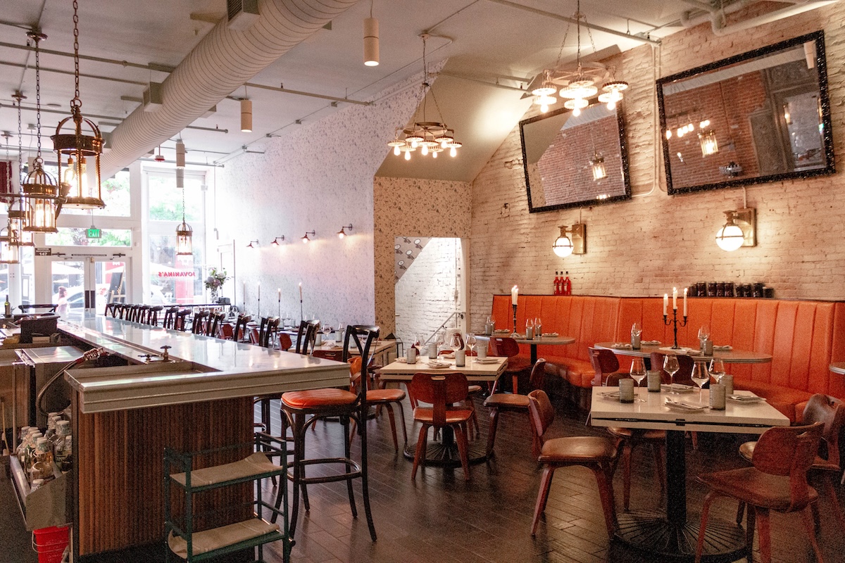 Get excited to eat in this beautiful dining room complete with real candles. | Photo by Jovanina's Broken Italian
