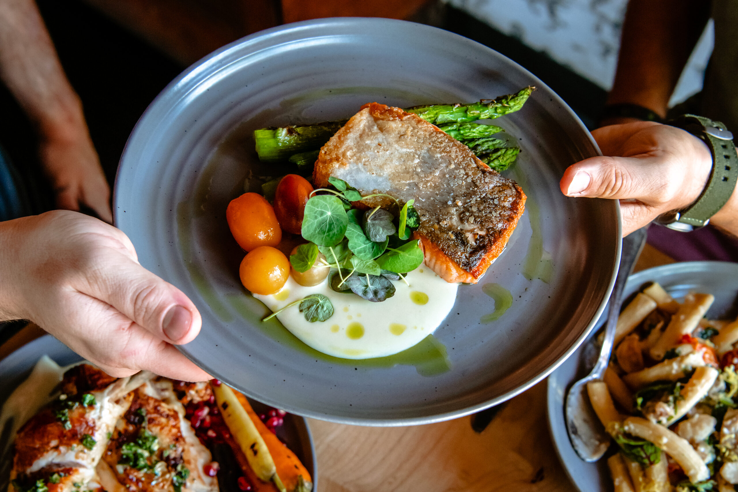 - DiningOut Take it from someone who's seen it all - the delis of New York, the cafes of Paris, the food stalls in Bangkok: When you stumble upon a gem like American Elm, you don't just savor the meal; you linger, maybe pen a long, pensive postcard to your ex just to make them a tad bit jealous. And then order another drink.
In the heart of Denver's West Highland neighborhood, a titan of a tree reigns supreme. Much like a fashion-forward Brooklyn hipster at a country club, the American Elm tree demands attention at the center of the restaurant’s sprawling patio. It’s the kind of ambiance that screams, “Take an Instagram pic or it didn’t happen.” If Mother Nature was into Michelin Stars, American Elm would surely get a nod.