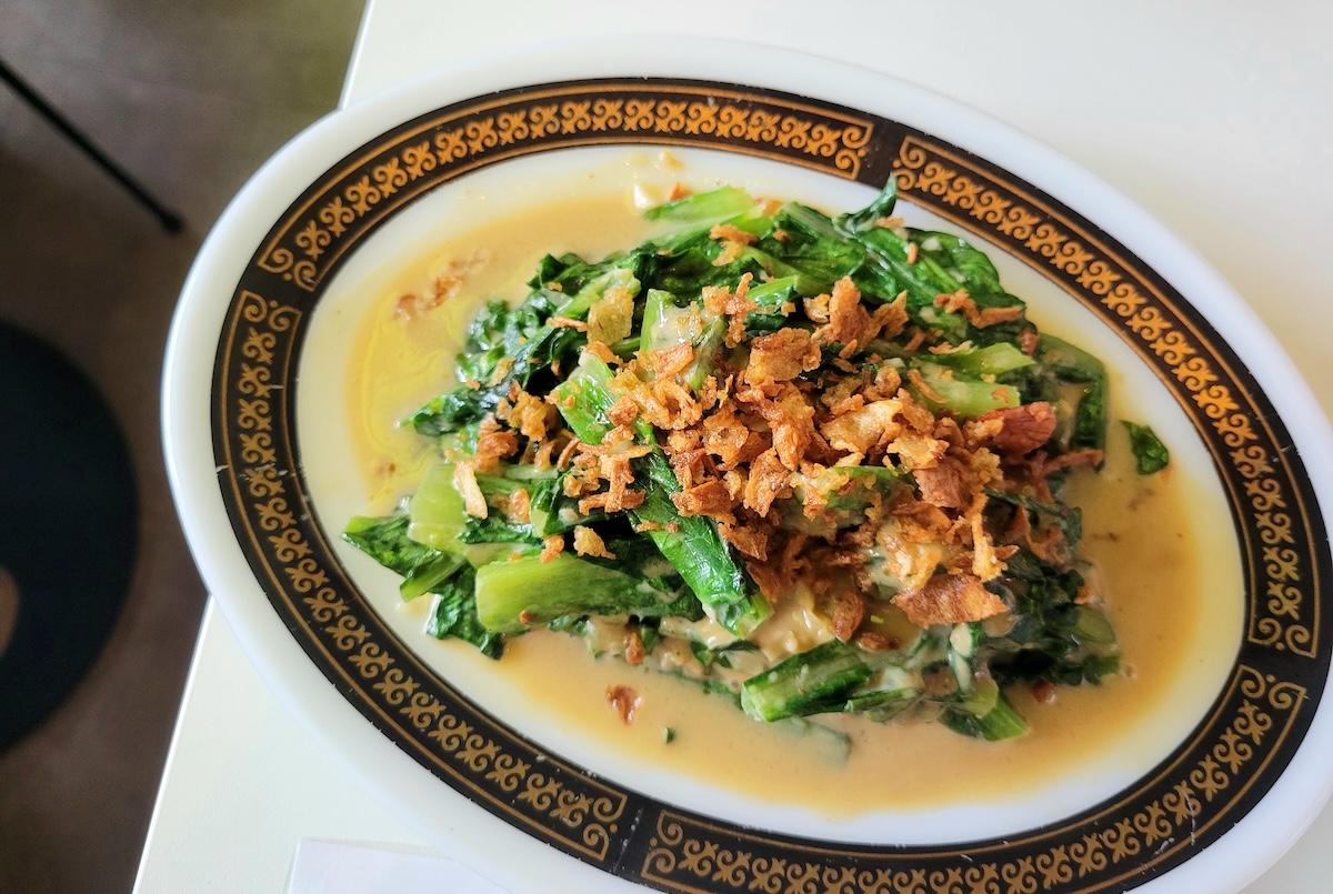 Stir-fried greens at MAKfam. | Photo by Linnea Covington
