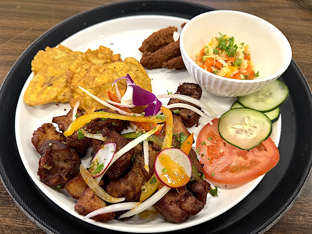 IMG_2113-HR - DiningOut Griot, a marinated pork shoulder and belly that's slow briased and then fried. Served at 509 Cuisine in Mango House. | Photo by Antony Bruno