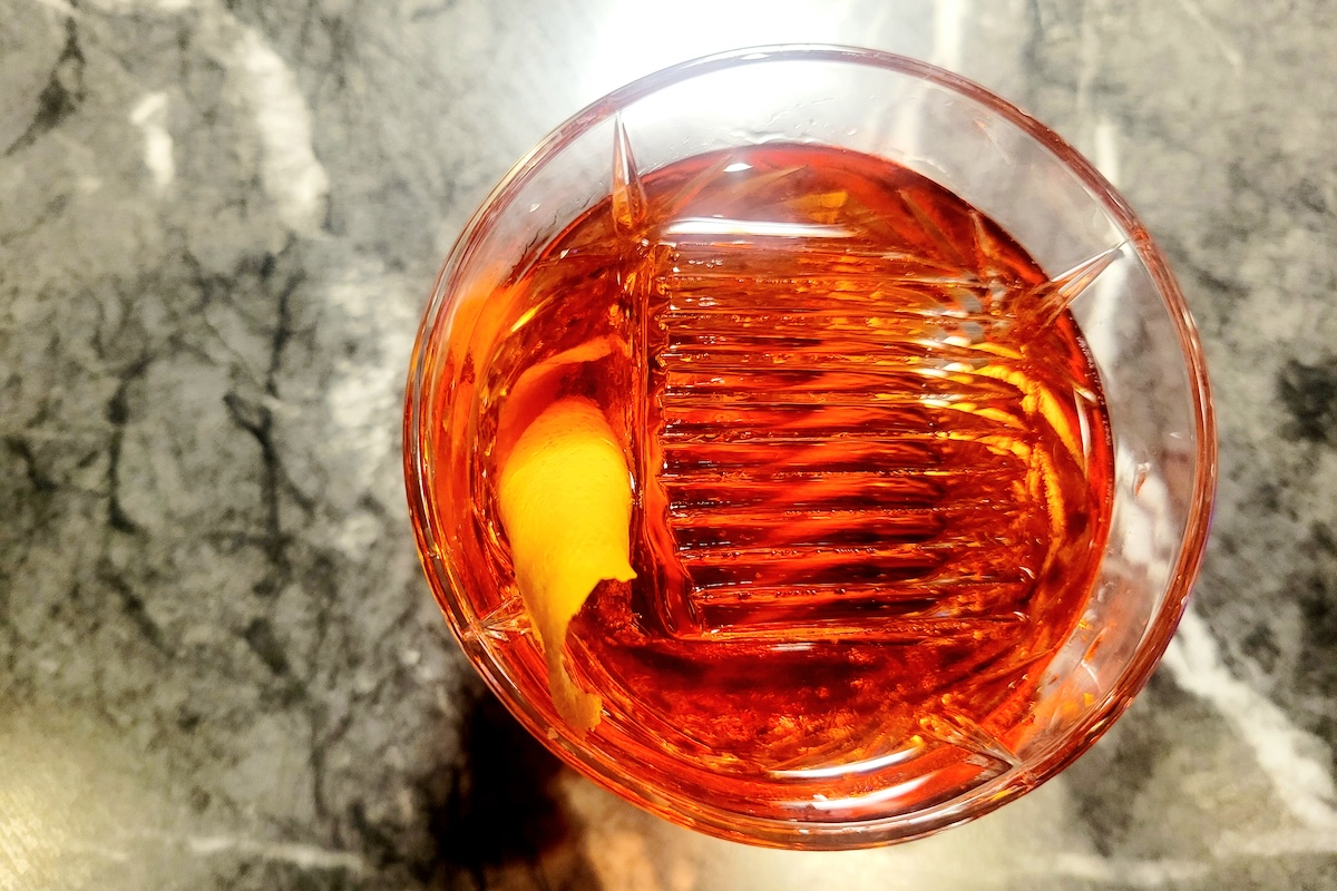 marble table with negroni on it