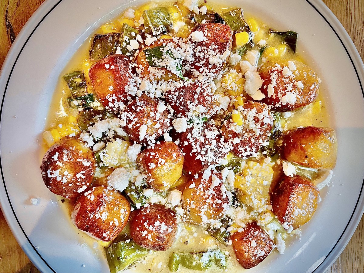 Gnocchi with summer squash and corn is among the pasta dishes available in half portions at Ostia. | Photo by Greg Morago
