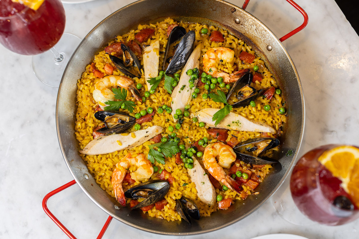 Paella loaded with chicken, shrimp, sausage, calamari, and mussels at Brasserie 19. | Photo by Andy Hemingway