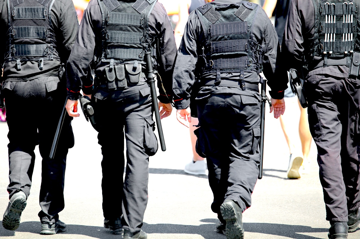 four men with bulletproof vest on the city - DiningOut ICE agents have landed in full force in Denver, and restaurant owners and workers are worried.