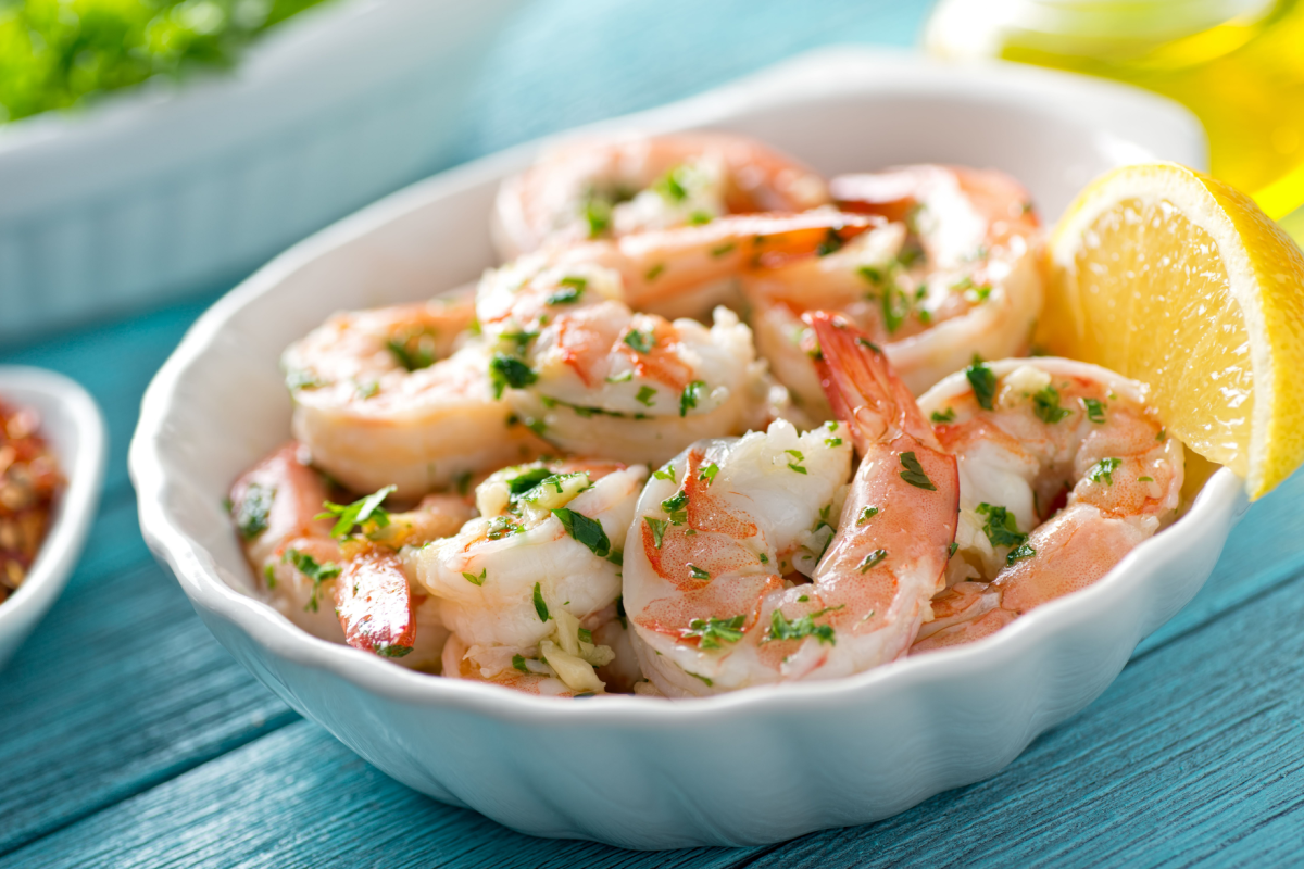 - DiningOut A delicious bowl of shrimp scampi with garlic, butter, and parsley.