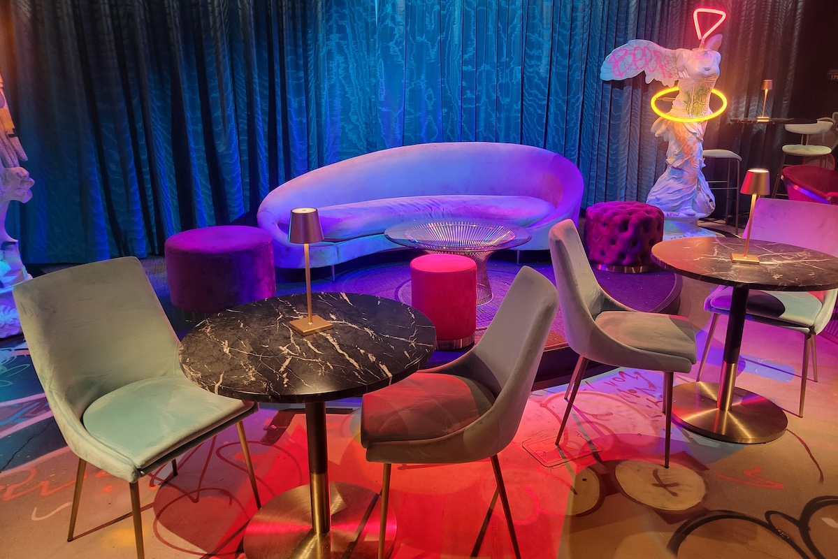 colorful room with couch and chairs