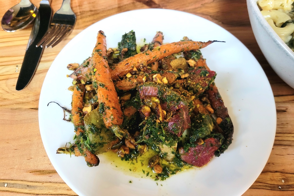 Roasted carrots with radish and pesto at Somebody People's Sunday Supper. | Photo by Linnea Covington