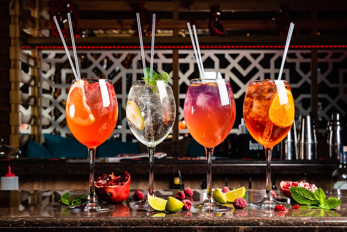 A line up of colorful spritzes by stock photo