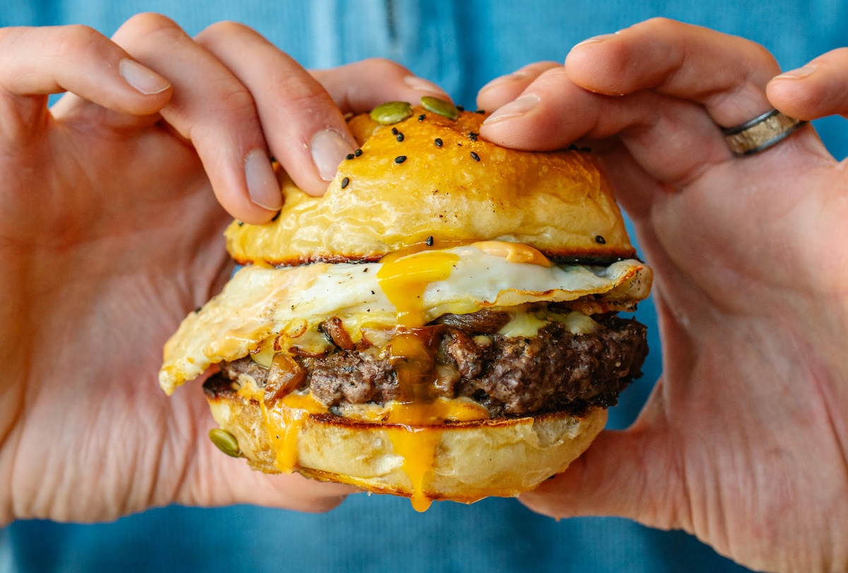 The Breakfast Burger is almost as big as the classic cheeseburger at Sullivan Scrap Kitchen. | Photo by Beyond the Apron Media