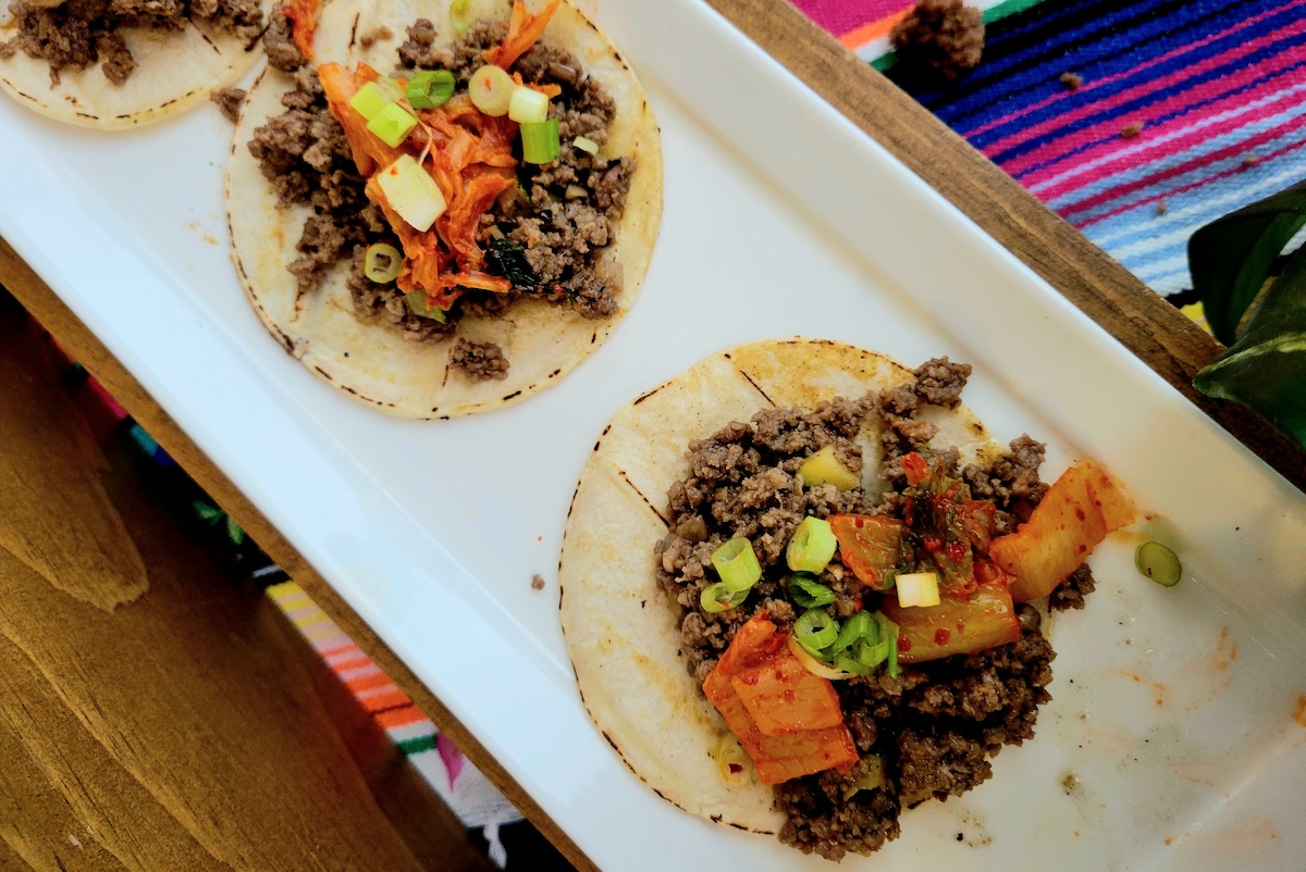 - DiningOut Global A Korean beef style taco with kimchi at Top Taco 2024. | Photo by Linnea Covington