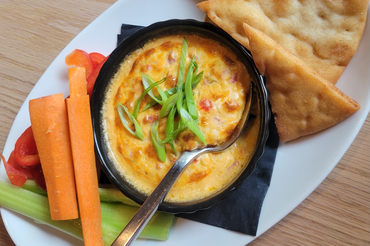 Pimento cheese dip with warm pita and veggies, served during happy hour at The Velvet Cellar. | Photo by Linnea Covington